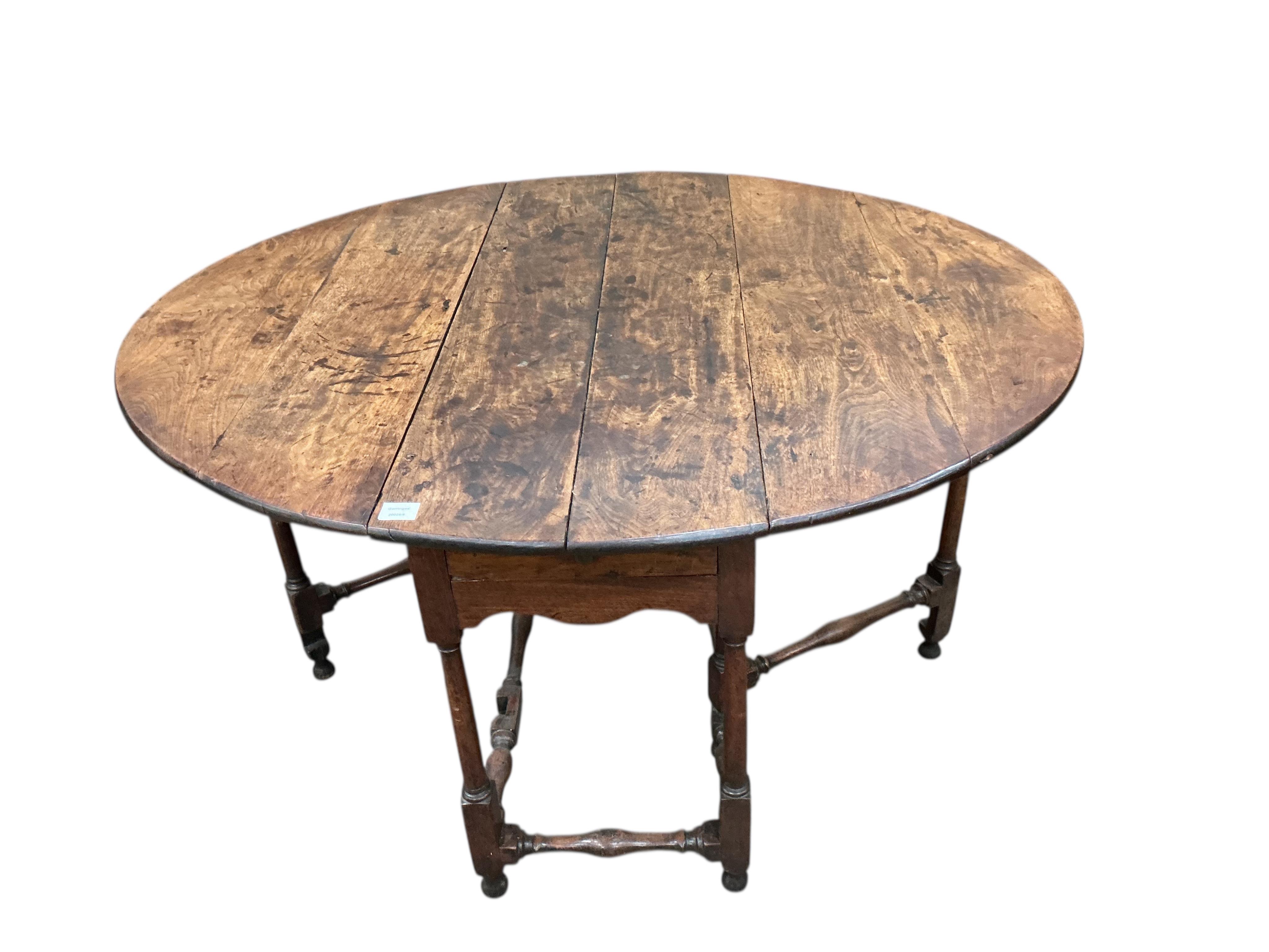 An 17th / 18th century fruitwood gateleg table, width 116cm, depth 46cm, height 74cm